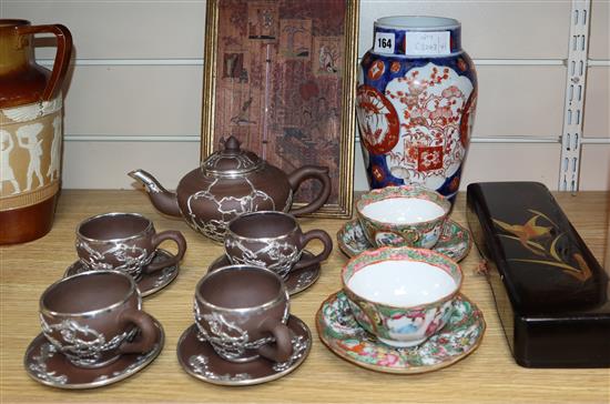 A Chinese white metal mounted tea set, an Imari vase, etc.